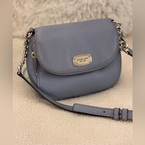 Michael Kors crossbody handbag// adjustable strap// fairly small// many pockets